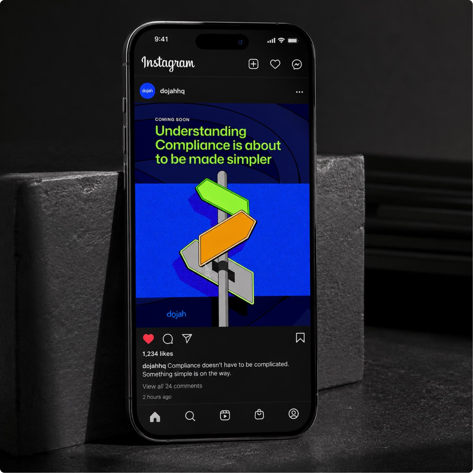 Phone on a dark stone surface showing a Dojah Instagram post about simpler compliance